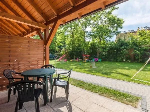 Деревянный коттедж Bursztynowy Zakatek