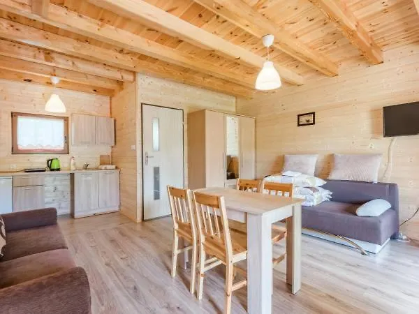 Деревянный коттедж Bursztynowy Zakatek